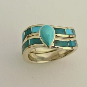 14 karat yellow gold wedding set with natural Turquoise inlay and a natural Turquoise center stone.