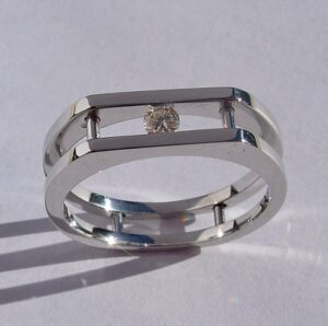 Mens-Ladies 14 Karat White Gold Ring with Round Channel Set Diamond.Southwest Originals 505-363-7150